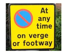sign reading now waiting at any time on verge or footway