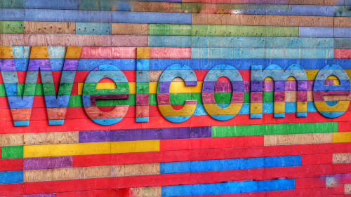 welcome written in different coloured wood
